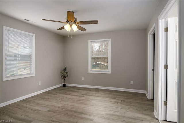 spare room featuring ceiling fan and light hardwood / wood-style floors