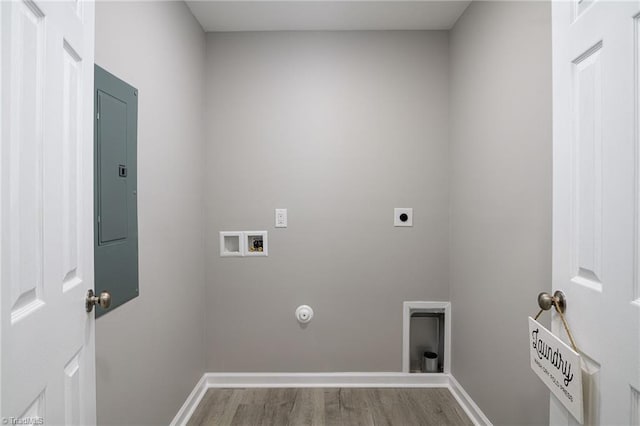 washroom with hardwood / wood-style flooring, hookup for a gas dryer, washer hookup, electric panel, and electric dryer hookup