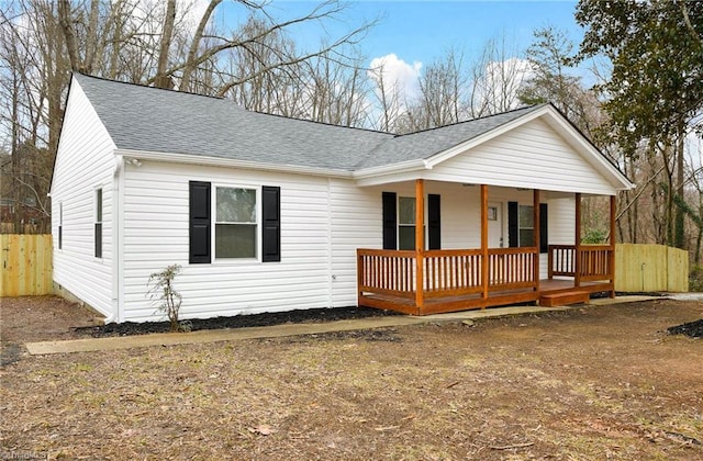 single story home featuring covered porch