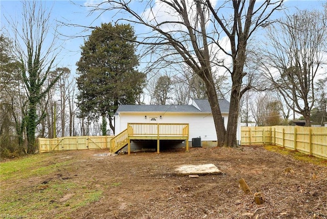 back of house with a wooden deck and central AC unit