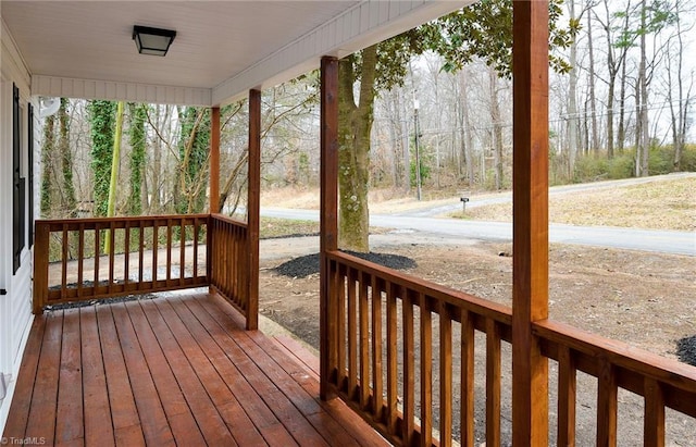 wooden terrace featuring a porch