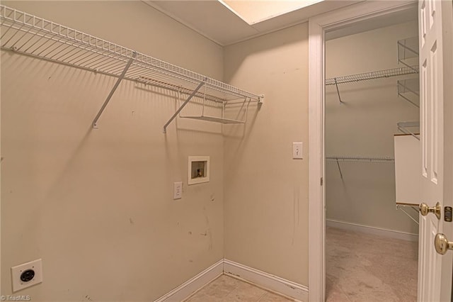 laundry area with washer hookup and hookup for an electric dryer