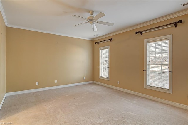 spare room with light carpet, ceiling fan, and ornamental molding