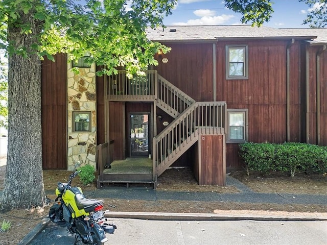 102 Aspen Ct, Winston-Salem, NC 27106 - entrance to property with stone siding and roof with shingles