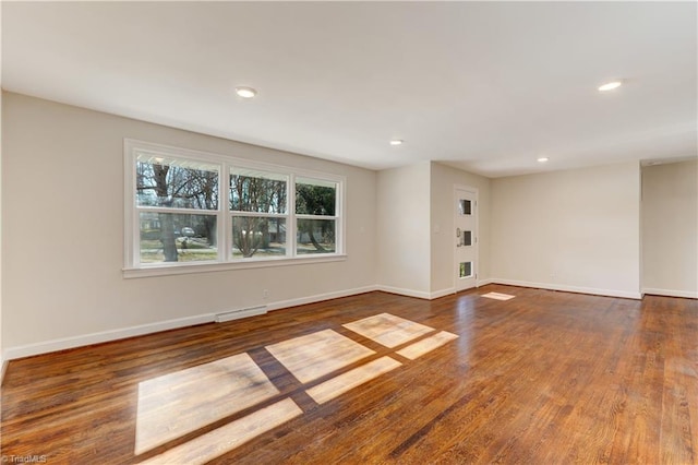 empty room featuring dark wood-type flooring