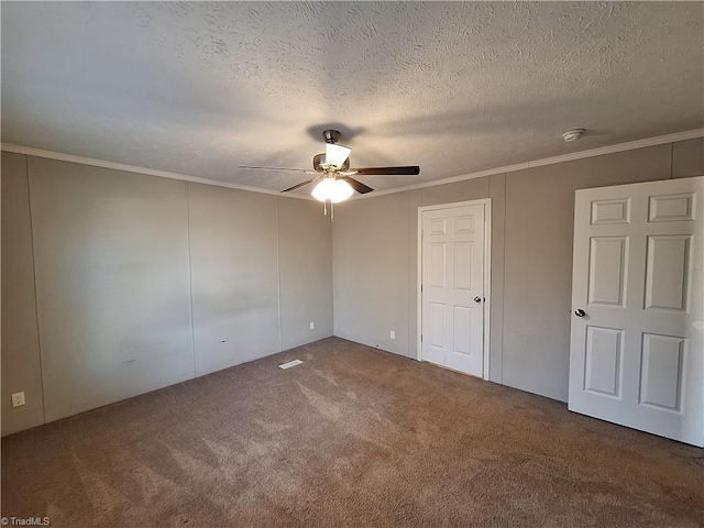 unfurnished bedroom featuring a textured ceiling, ceiling fan, ornamental molding, and carpet flooring