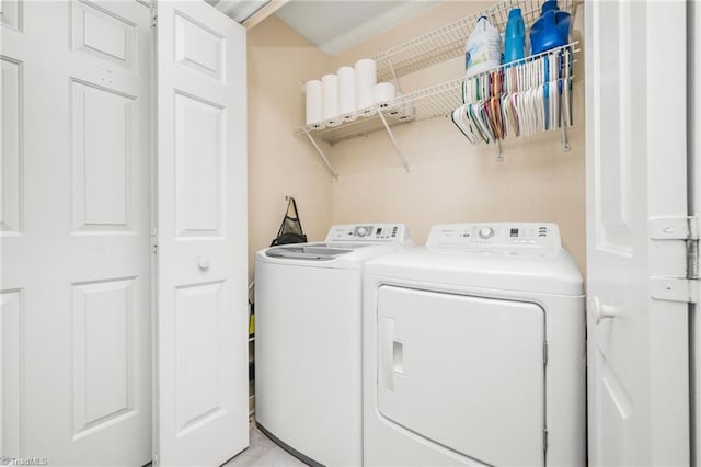 washroom featuring washer and dryer