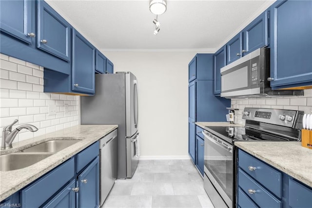 kitchen with stainless steel appliances, a sink, blue cabinetry, ornamental molding, and backsplash