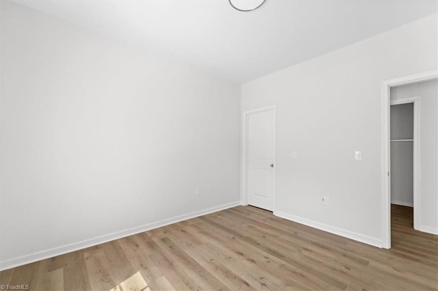 2154 E First St, Winston-Salem, NC 27101 - unfurnished bedroom with light wood finished floors and baseboards