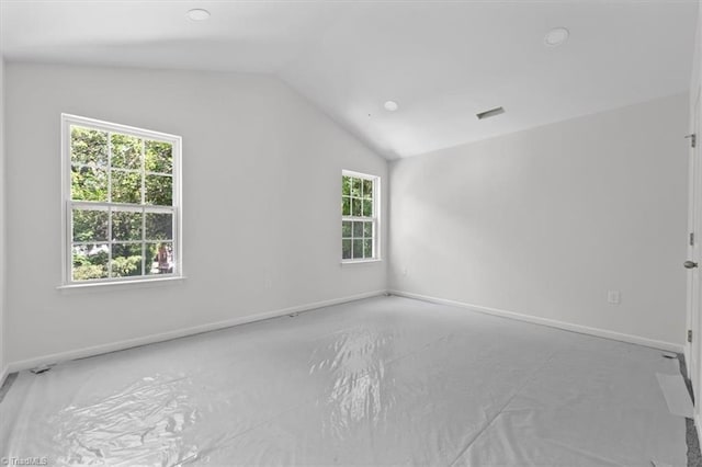 2154 E First St, Winston-Salem, NC 27101 - spare room featuring vaulted ceiling, plenty of natural light, baseboards, and recessed lighting