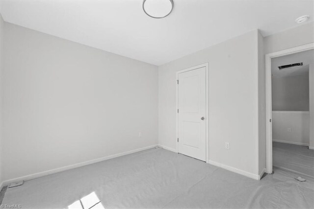 2154 E First St, Winston-Salem, NC 27101 - unfurnished bedroom featuring baseboards and carpet flooring