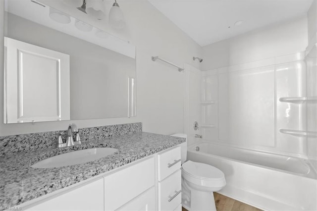 2154 E First St, Winston-Salem, NC 27101 - full bathroom featuring vanity, toilet, washtub / shower combination, and wood finished floors
