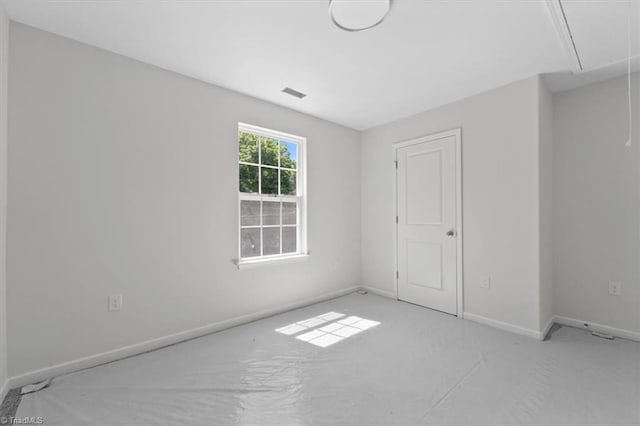 2154 E First St, Winston-Salem, NC 27101 - empty room featuring attic access and baseboards