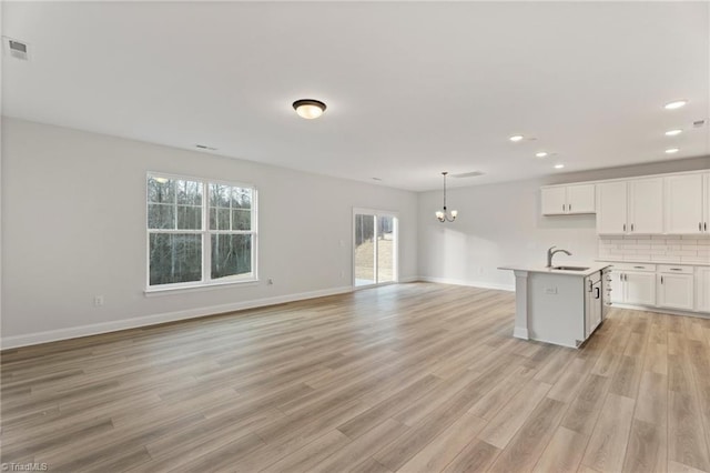 5756 Siler St, Trinity, NC 27370 - kitchen featuring open floor plan, a chandelier, healthy amount of natural light, light wood-style floors, and recessed lighting