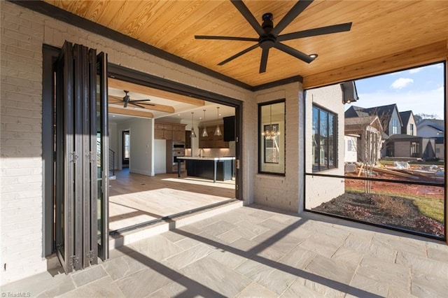 view of patio / terrace featuring ceiling fan