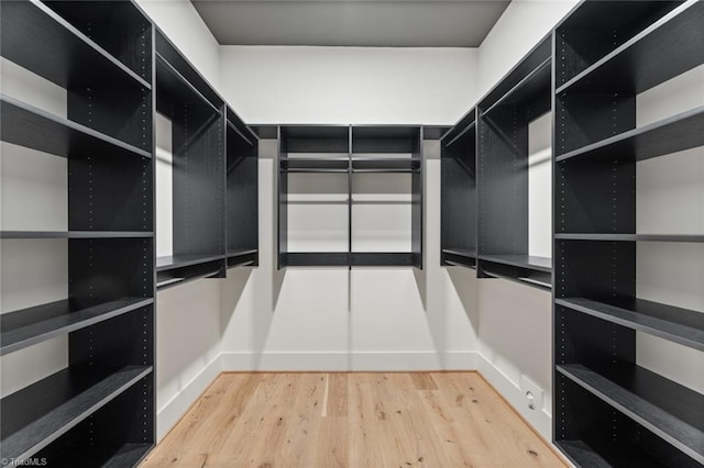 spacious closet with light wood finished floors