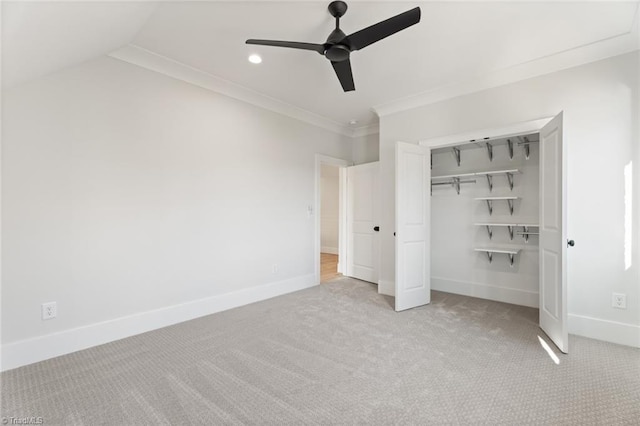 unfurnished bedroom with baseboards, carpet floors, recessed lighting, a closet, and crown molding