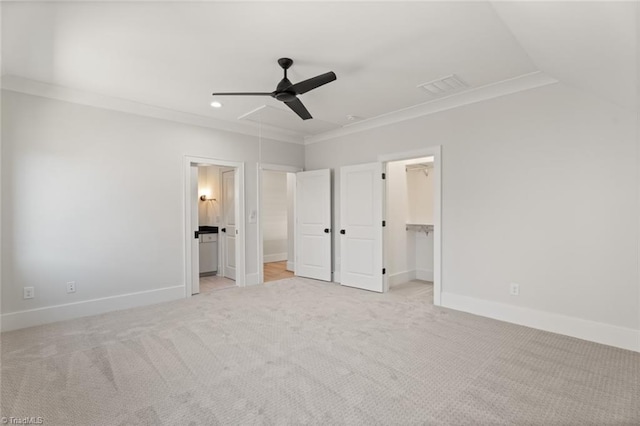 unfurnished bedroom featuring attic access, baseboards, visible vents, and ornamental molding