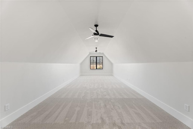 bonus room featuring a ceiling fan, lofted ceiling, carpet, and baseboards