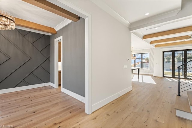 hall featuring beam ceiling, crown molding, wood finished floors, and baseboards