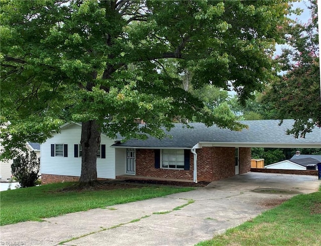 view of front facade with a carport and a front lawn