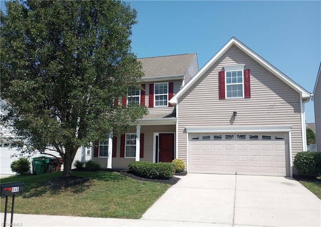 view of front of home featuring a garage and a front lawn