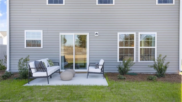 back of property featuring a yard and a patio