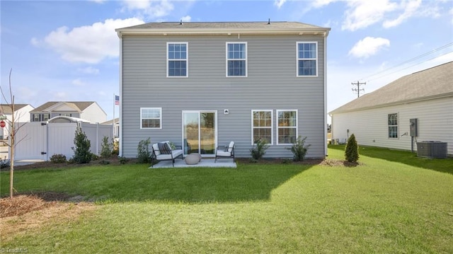 rear view of house featuring a yard and a patio