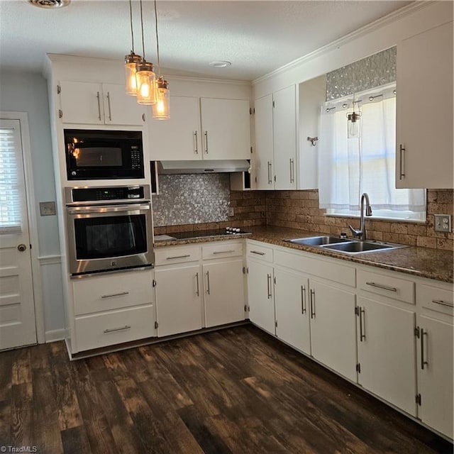 kitchen featuring dark wood-type flooring, white cabinetry, sink, and black appliances