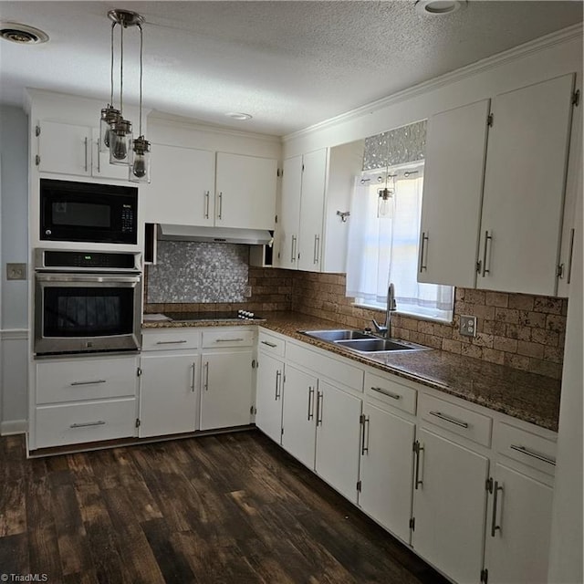 kitchen with black appliances, sink, dark hardwood / wood-style floors, a textured ceiling, and white cabinetry