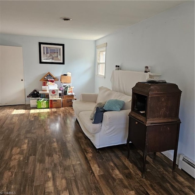 sitting room with dark hardwood / wood-style floors and a baseboard radiator