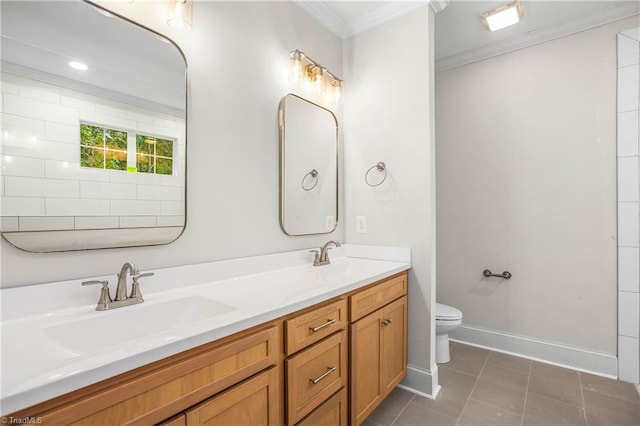 bathroom featuring tile patterned flooring, crown molding, vanity, and toilet