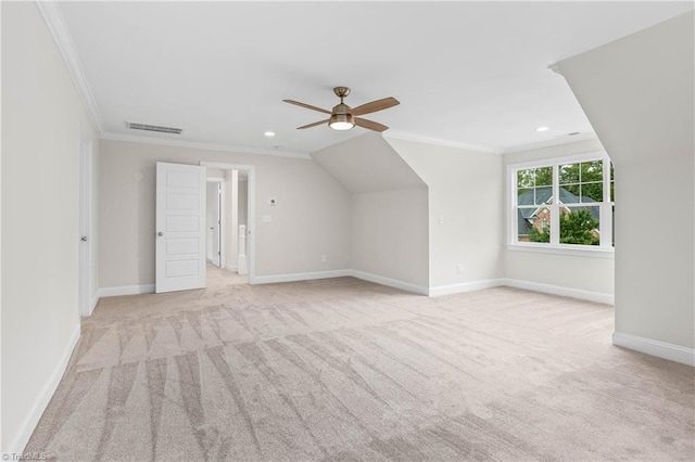 additional living space with ceiling fan, light colored carpet, and lofted ceiling