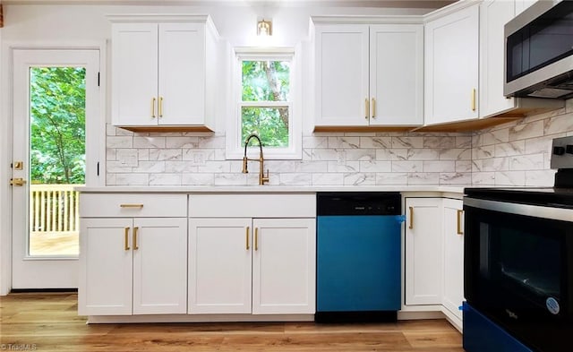 1628 Eagle Crest Dr, Pfafftown, NC 27040 - kitchen featuring dishwasher, stainless steel microwave, black electric range oven, light countertops, and white cabinetry