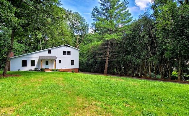 1628 Eagle Crest Dr, Pfafftown, NC 27040 - view of front of home with a front lawn and a forest view
