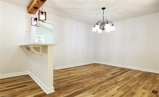 1628 Eagle Crest Dr, Pfafftown, NC 27040 - unfurnished dining area featuring wood finished floors and a chandelier