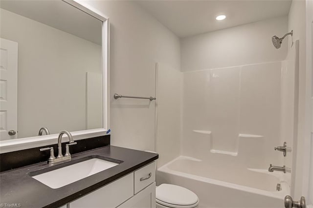 bathroom featuring recessed lighting, shower / bath combination, vanity, and toilet