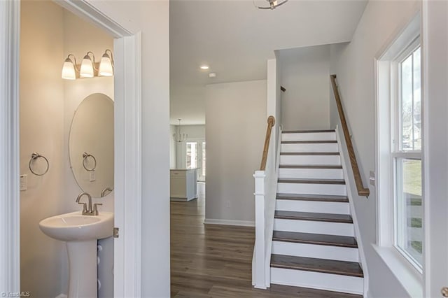 stairs featuring recessed lighting, baseboards, and wood finished floors