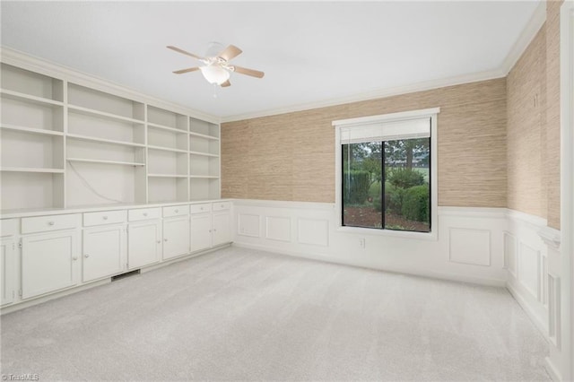 191 Fairway Dr, Advance, NC 27006 - unfurnished room featuring a ceiling fan, light carpet, a wainscoted wall, ornamental molding, and a decorative wall