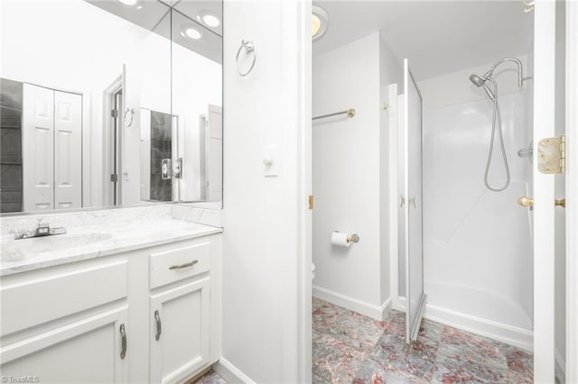 191 Fairway Dr, Advance, NC 27006 - bathroom with vanity, a shower stall, a closet, baseboards, and toilet