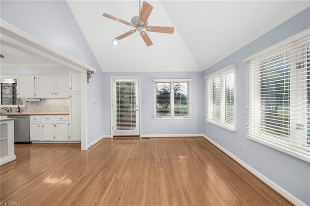 191 Fairway Dr, Advance, NC 27006 - unfurnished living room featuring a ceiling fan, lofted ceiling, light wood finished floors, plenty of natural light, and baseboards
