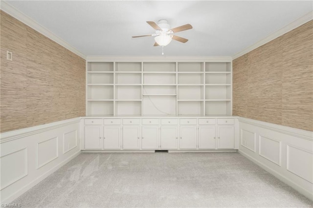 191 Fairway Dr, Advance, NC 27006 - unfurnished room with ceiling fan, wainscoting, a decorative wall, light colored carpet, and crown molding