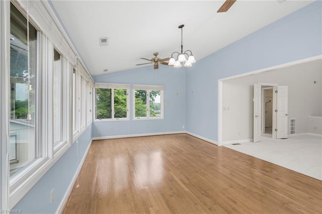 191 Fairway Dr, Advance, NC 27006 - spare room with a ceiling fan, a chandelier, wood finished floors, baseboards, and vaulted ceiling