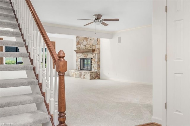 191 Fairway Dr, Advance, NC 27006 - staircase with ceiling fan, carpet, baseboards, crown molding, and a fireplace