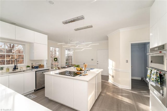 kitchen with appliances with stainless steel finishes, white cabinetry, and modern cabinets