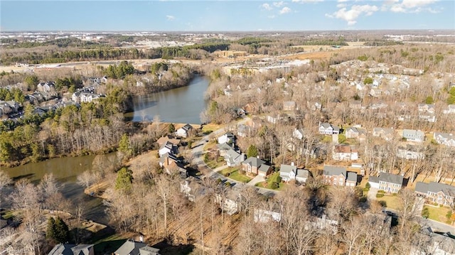 drone / aerial view featuring a water view and a residential view