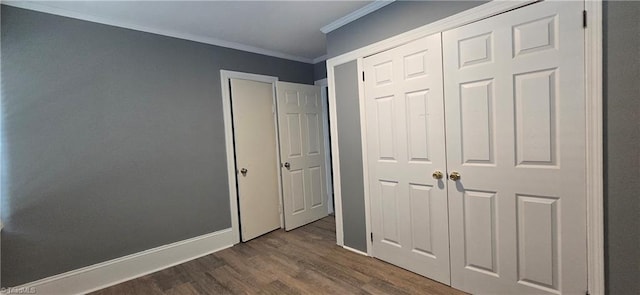 1904 E Innes St, Salisbury, NC 28146 - unfurnished bedroom with crown molding, dark wood finished floors, and a closet