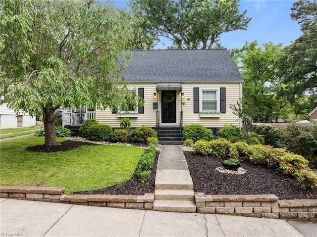 2607 Sherwood St, Greensboro, NC 27403 - view of front of home with a front lawn and roof with shingles