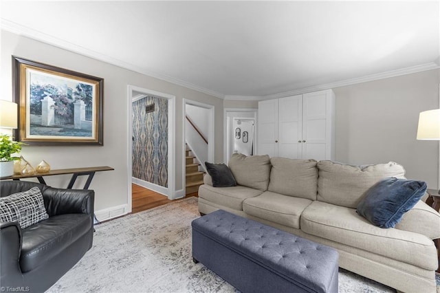 2607 Sherwood St, Greensboro, NC 27403 - living area featuring stairs, crown molding, and wood finished floors