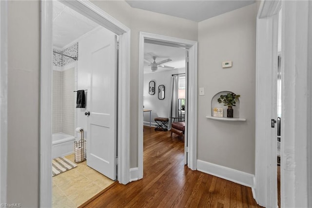 2607 Sherwood St, Greensboro, NC 27403 - hallway with baseboards and wood finished floors
